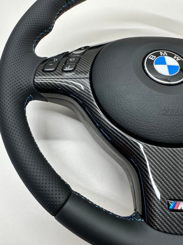 Bmw E46 E39 Steering wheel carbon trim close up showing left side of carbon trim