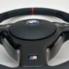 Bmw E46 E39 Steering wheel with carbon trim and red stripe showcasing stitching quality