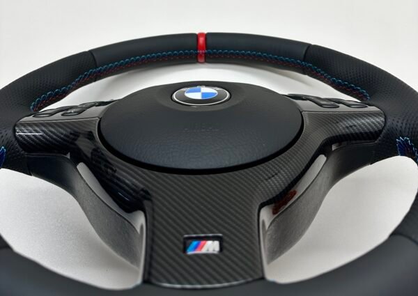 Bmw E46 E39 Steering wheel with carbon trim and red stripe showcasing stitching quality