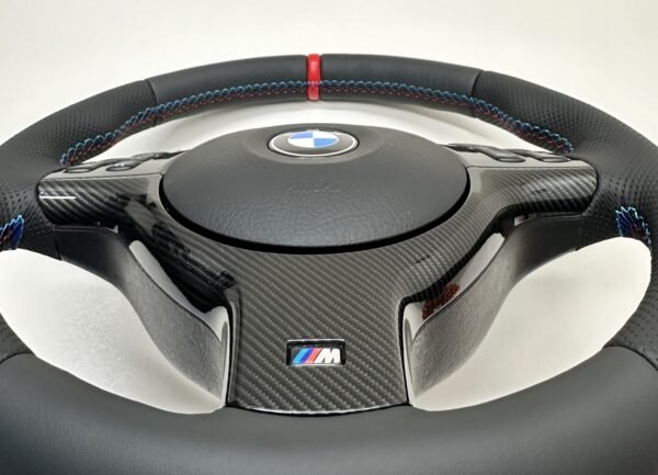Bmw E46 E39 Steering wheel with carbon trim and red stripe shiwcasing carbon quality closeup zoom