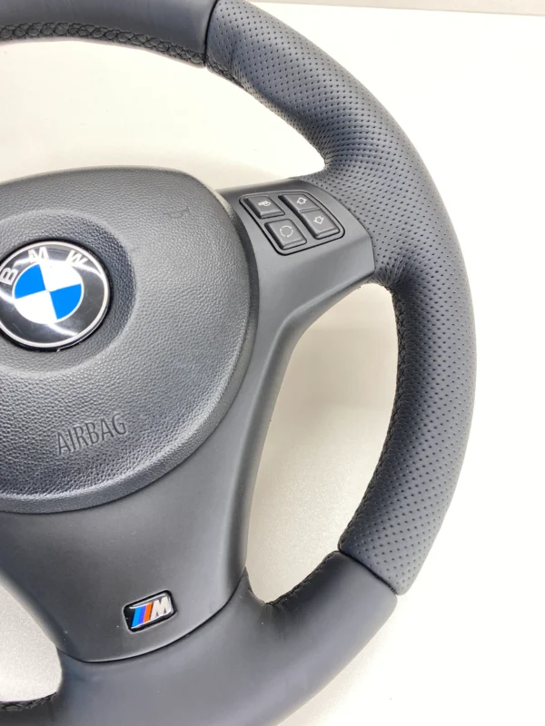 bmw e82 e88 e92 m sport steering wheel closeup bottom right of the steering wheel