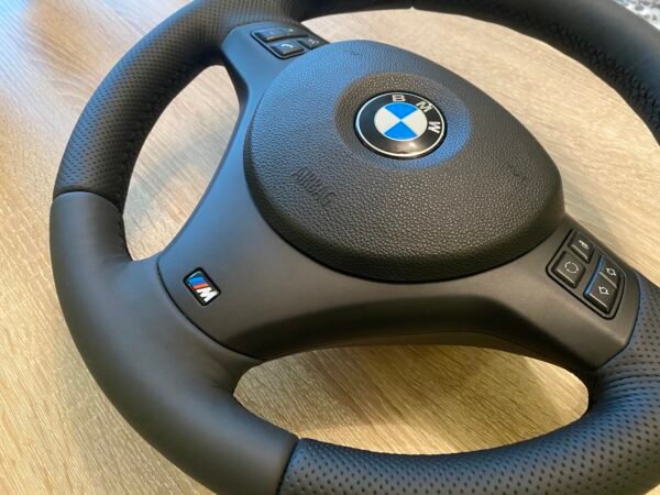 side profile of bmw e90 e92 m sport steering wheel plastic trim with airbag installed