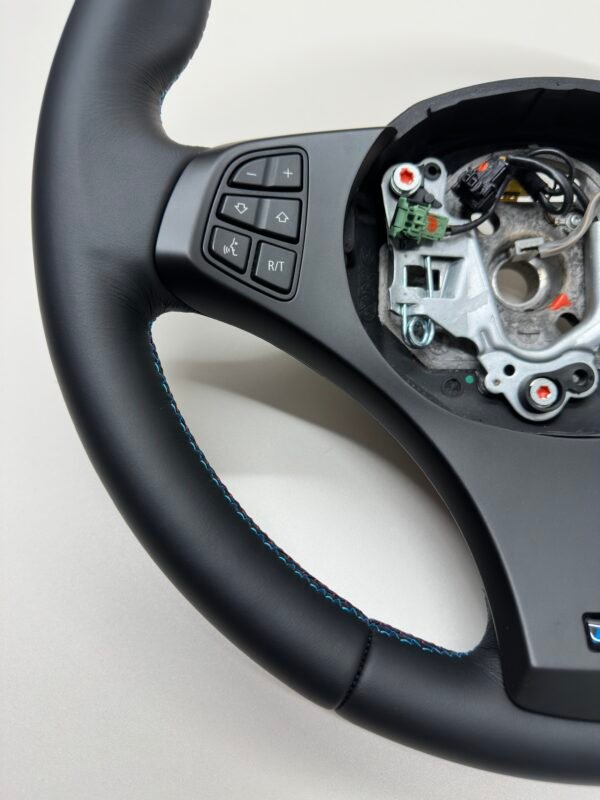 bmw-e83-x3-m-sport-steering-wheel-06 bmw e83 x3 m sport steering wheel smooth leather m stitching no airbag bottom left view