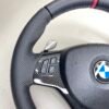 bmw e88 e90 e92 m sport steering wheel with pre lci paddles carbon trim red stripe m stitching top left view