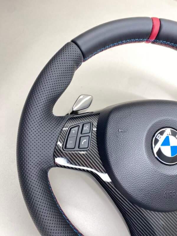 bmw e88 e90 e92 m sport steering wheel with pre lci paddles carbon trim red stripe m stitching top left view