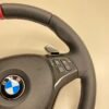 bmw e88 e90 e92 m sport steering wheel with pre lci paddles carbon trim red stripe m stitching top right view