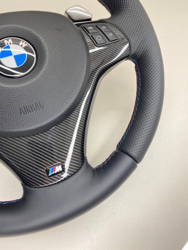 bmw e88 e90 e92 m sport steering wheel with pre lci paddles carbon trim red stripe m stitching bottom right view