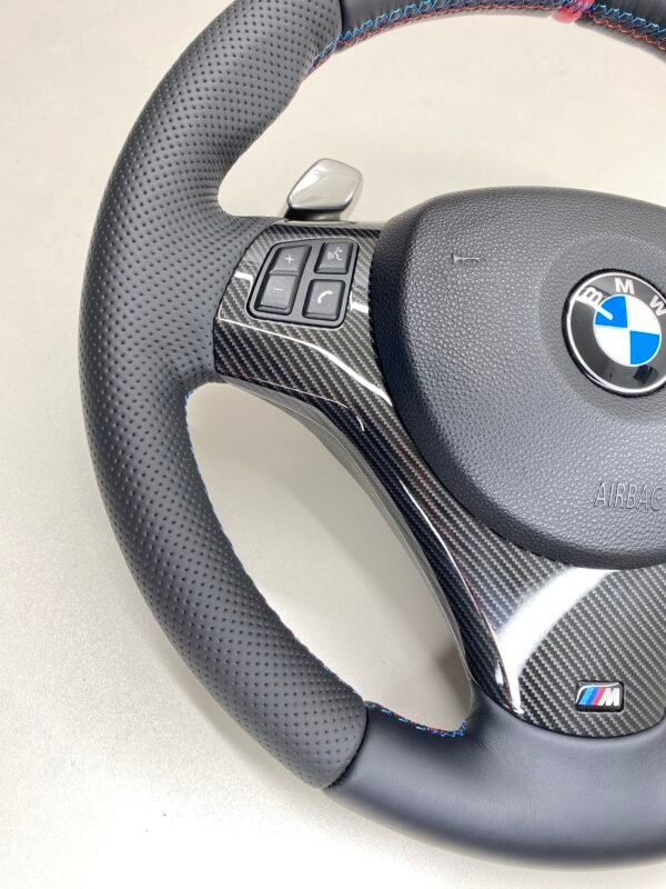 bmw e88 e90 e92 m sport steering wheel with pre lci paddles carbon trim red stripe m stitching bottom left view