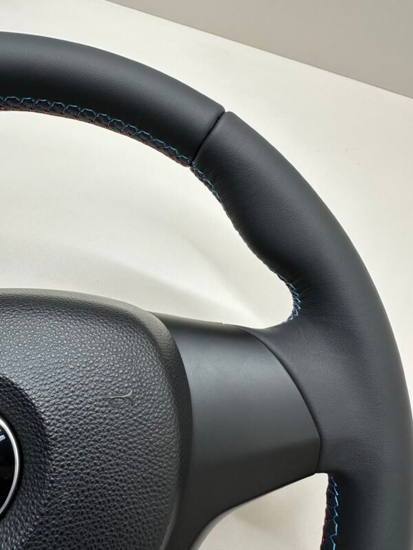 buttonless bmw e90 e92 e87 e82 m sport steering wheel top right closeup