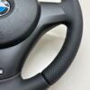 Bottom right view of a buttonless BMW M Sport steering wheel for E90 E92 E87 E82 with black stitches