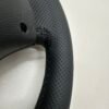 back side view of a buttonless BMW M Sport steering wheel for E90 E92 E87 E82 with black stitches