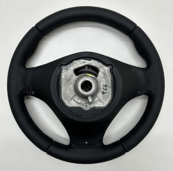 Back side view of a buttonless BMW M Sport steering wheel for E90 E92 E87 E82 with black stitches