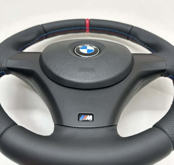 bottom side of buttonless BMW M Sport steering wheel for E90 E92 E87 E82 with m stitching and red stripe at top