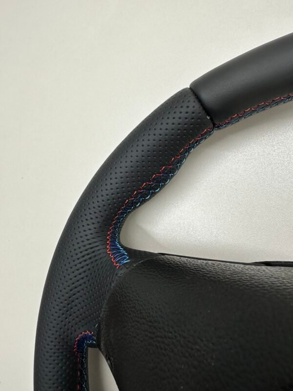 back side view of stitches buttonless BMW M Sport steering wheel for E90 E92 E87 E82 with m stitching and red stripe at top