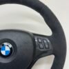 top right view of bmw e90 e92 m3 alcantara cs edition steering wheel with carbon trim buttons and airbag